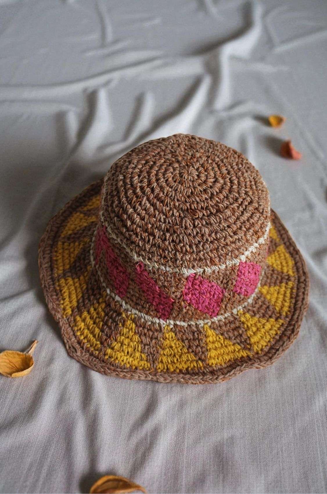hemp hat laid flat on a white cloth top view