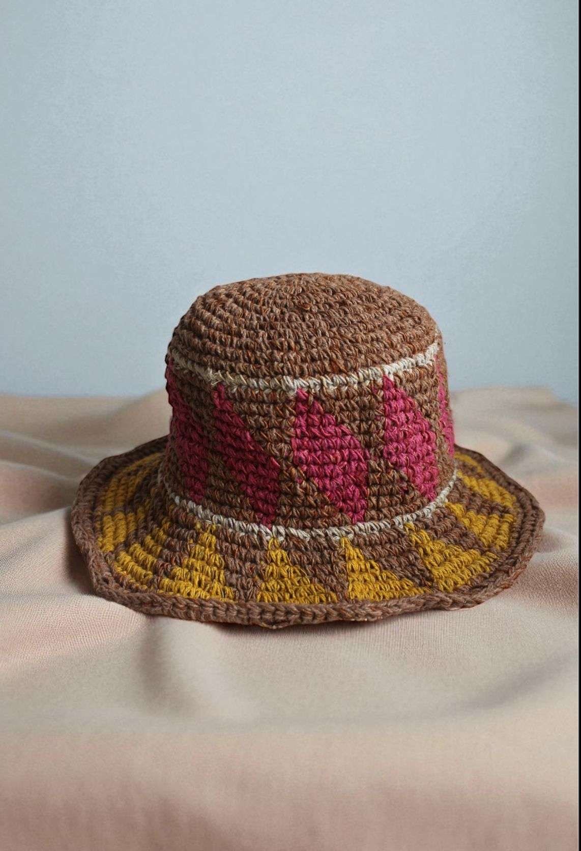 hemp hat laid flat on a white cloth front view