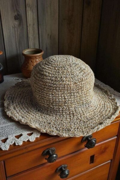 Textured Border Beige Crochet Hat – handmade hemp hat on table