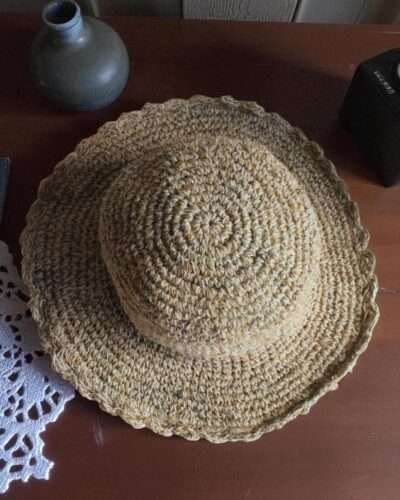 Textured Border Beige Crochet Hat – top view of handmade hemp hat on table