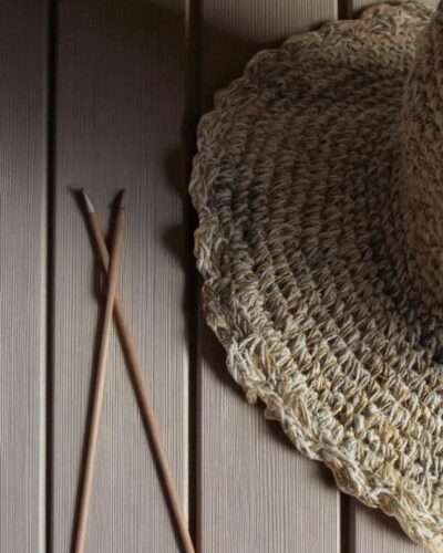 Textured Border Beige Crochet Hat – brim zoomed of handmade hemp hat on table