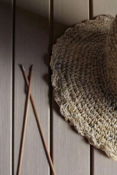 Textured Border Beige Crochet Hat – brim zoomed of handmade hemp hat on table