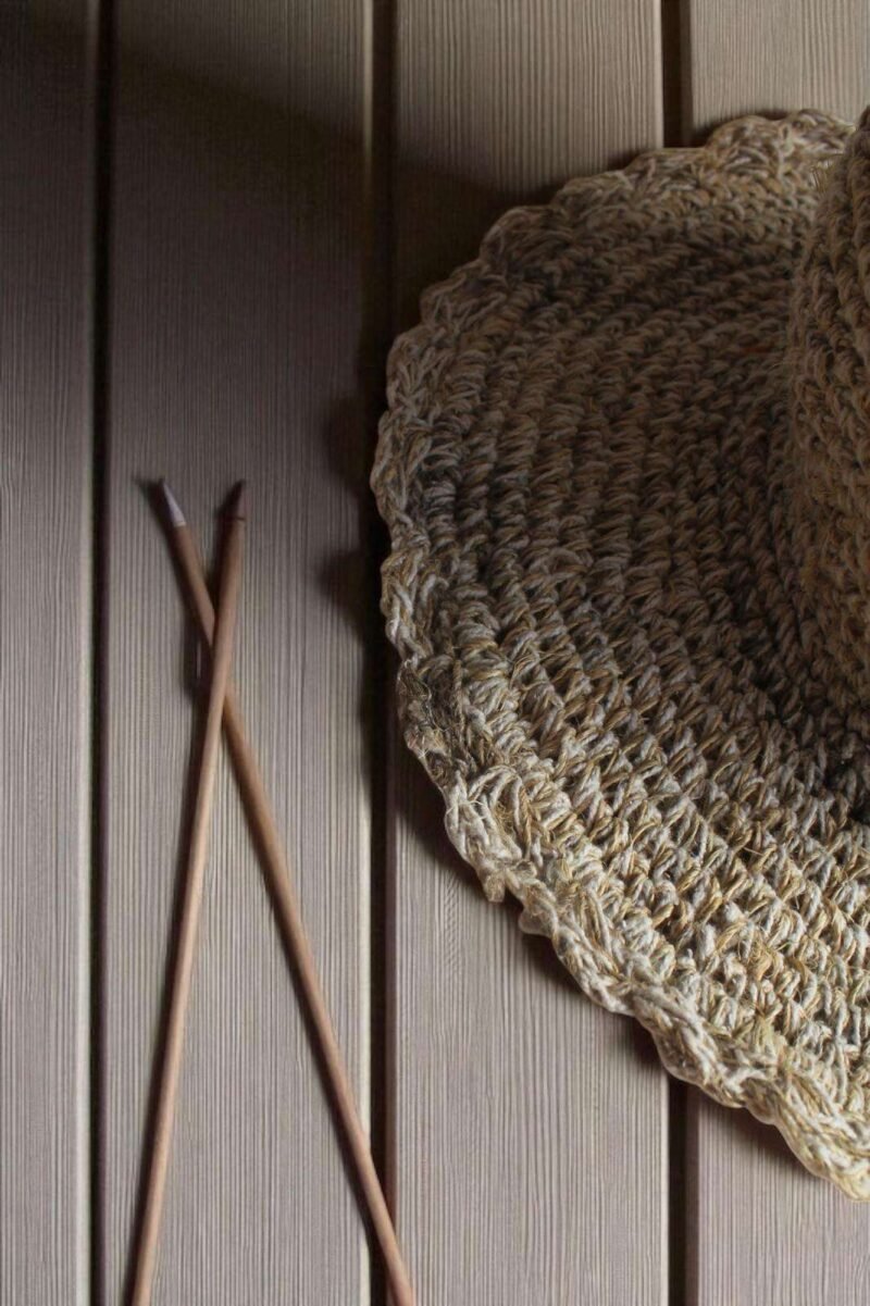 Textured Border Beige Crochet Hat – brim zoomed of handmade hemp hat on table