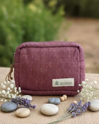 Aubergine color hemp travel pouch on a table front