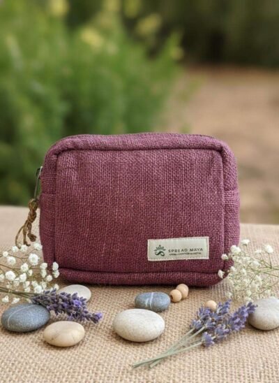 Aubergine color hemp travel pouch on a table front