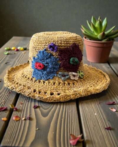 floral embroidery yellow hat on table