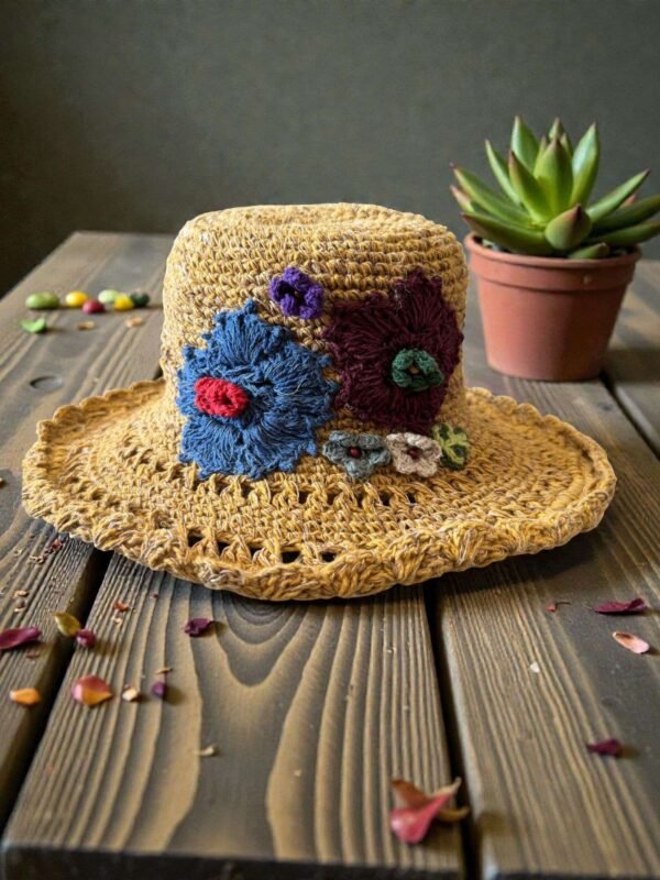 floral embroidery yellow hat on table