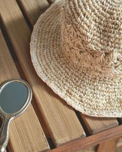 Kathmandu Knot Crochet Hat – zoomed handmade hemp hat on display