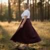 a women wearing a burgundy cotton wrap skirt