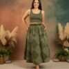 a model wearing earthy elegance skirt from spreadmaya and posing looking at the camera and hands in the pocket