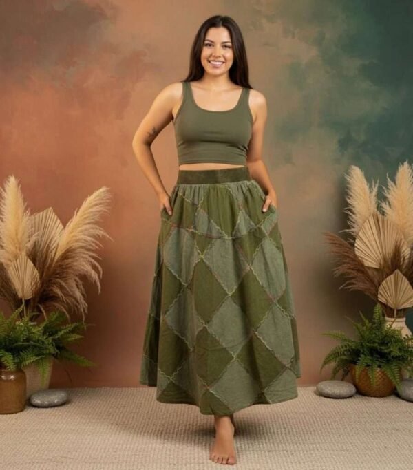 a model wearing earthy elegance skirt from spreadmaya and posing looking at the camera and hands in the pocket