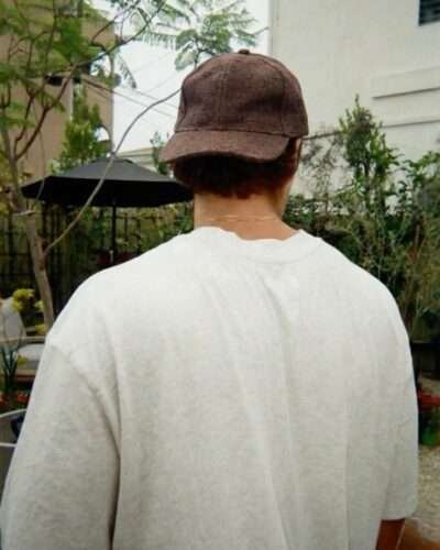 a man wearing brown spreadmaya hemp cap and posing from back