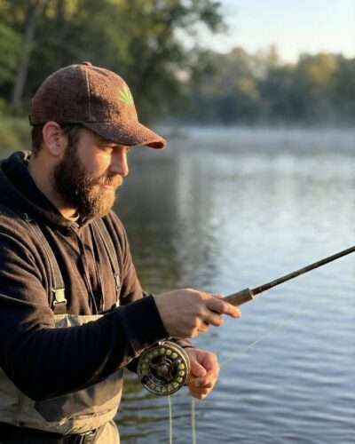 Man fishing outdoors wearing brown hemp cap, breathable and eco friendly