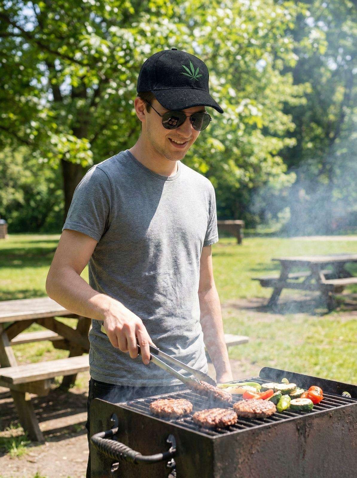 a man wearing hemp leaf printed black hat and BBQ