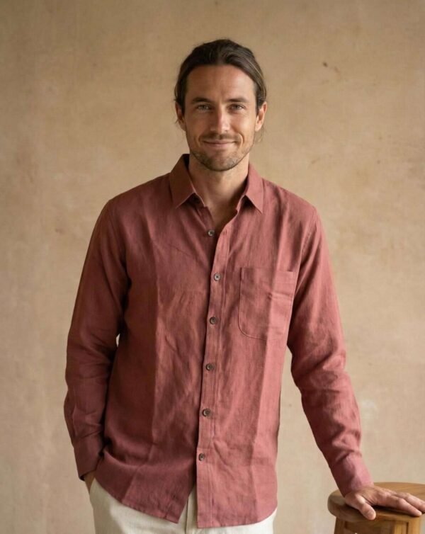 a man wearing full sleeve hemp shirt and smiling looking at the camera