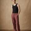 a man wearing full length hemp pants and posing