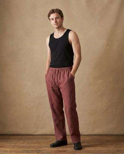 a man wearing full length hemp pants and posing