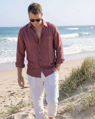 man wearing full sleeve hemp shirt at a beach in australia