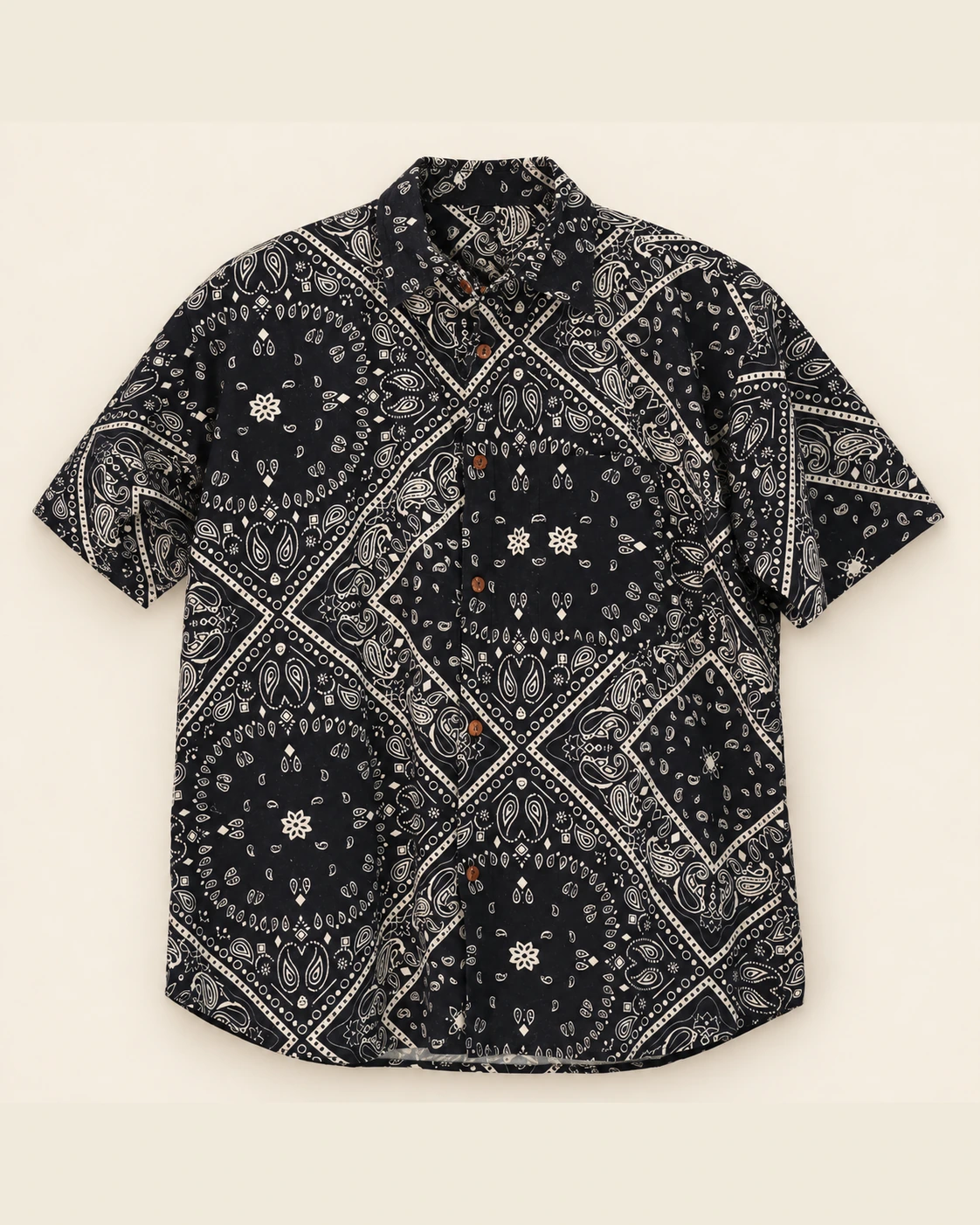 Spreadmaya black mandala hemp short sleeve shirt product photo on plain beige background.