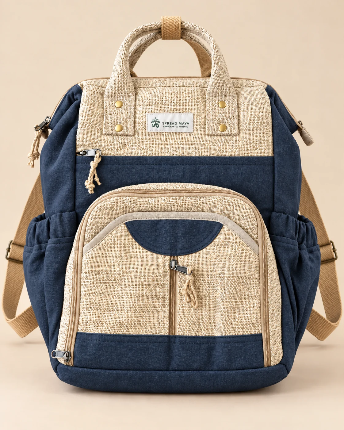 SpreadMaya charcoal blue and natural hemp maternity backpack with multiple compartments, bottle pockets and carry handles, handmade in Nepal.