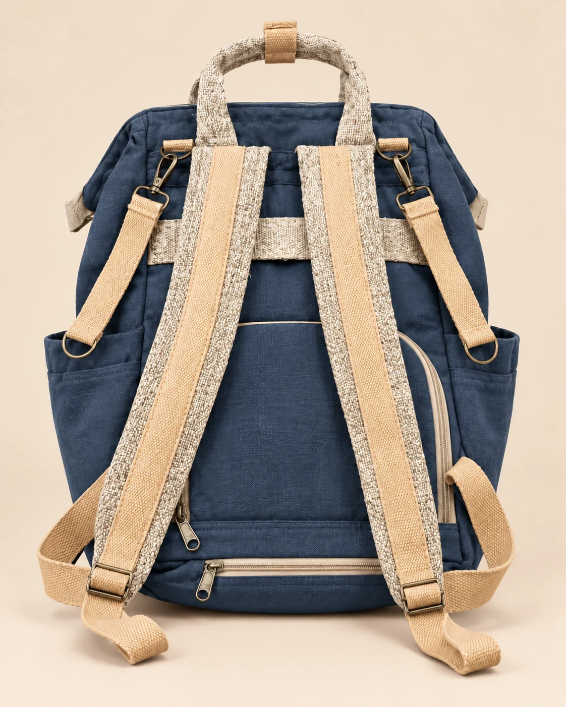 Back view of SpreadMaya hemp maternity backpack featuring adjustable shoulder straps, suitcase trolley sleeve and rear storage pocket.